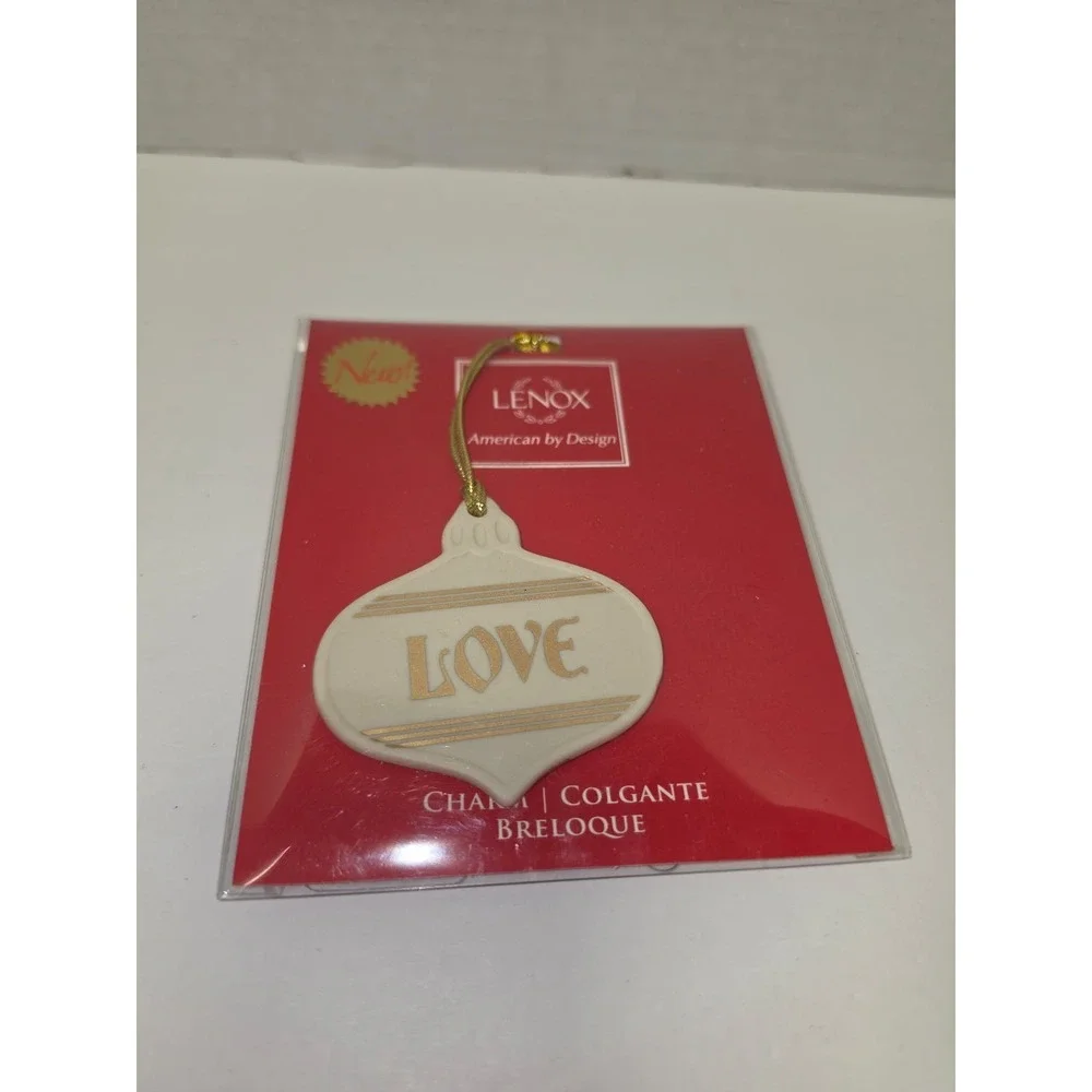 Lenox Love Golden Sentiment Charm Ornament features a cream-colored porcelain‎